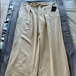 DKNY beige/tan colored (wheat) pants.